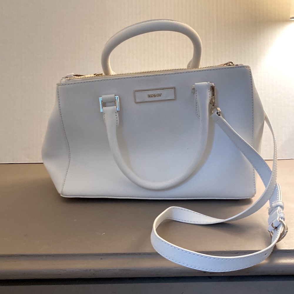 DKNY white handbag. Gold hardware. Strap and storage bag included.